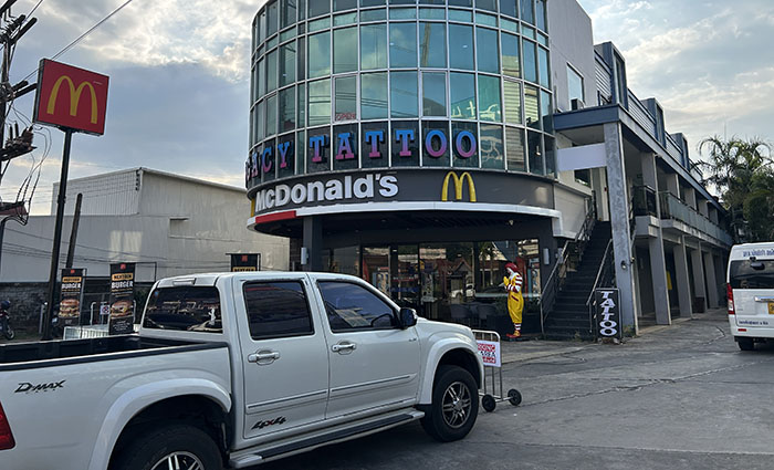 The minibus stop to Krabi is located on the opposite side of the road from McDonald's