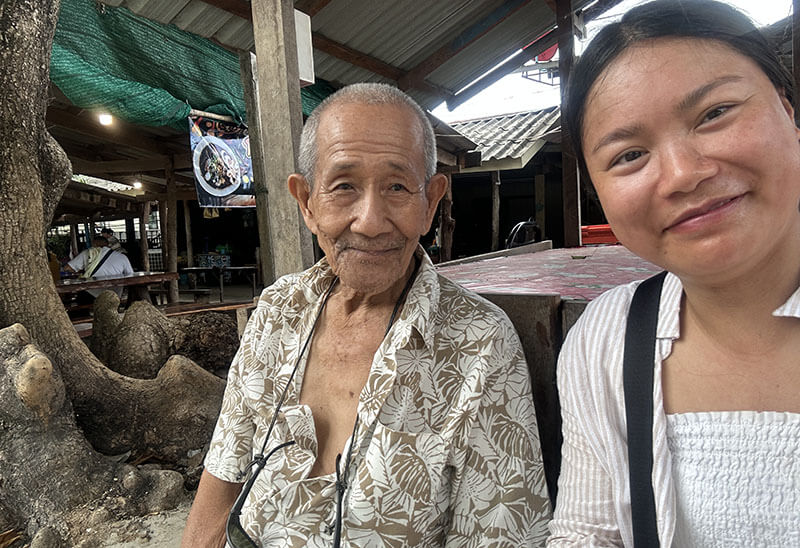 Talking to locals while waiting for bus