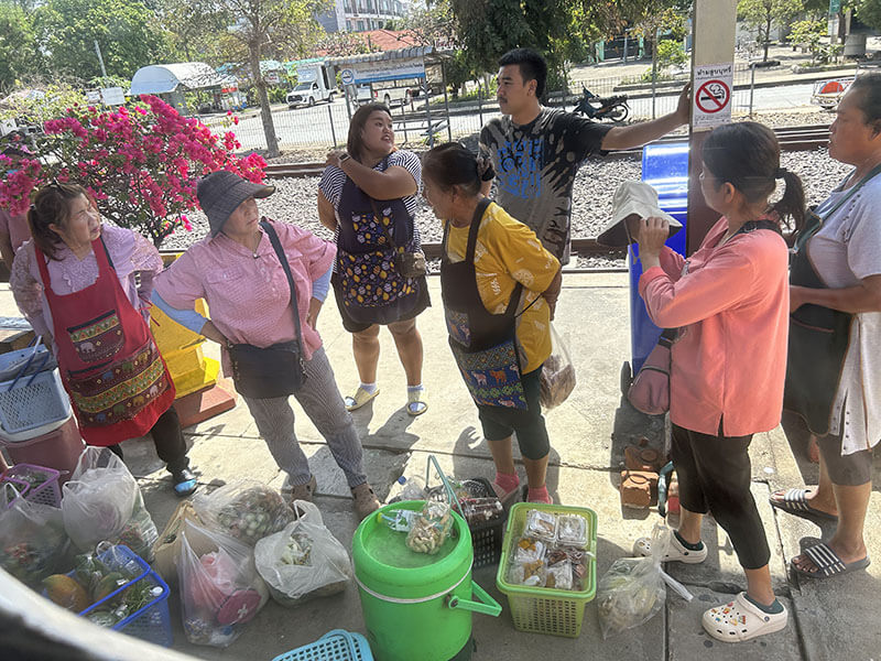 Locals sell food on the train