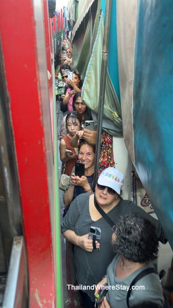 train passing Mae Klong Market