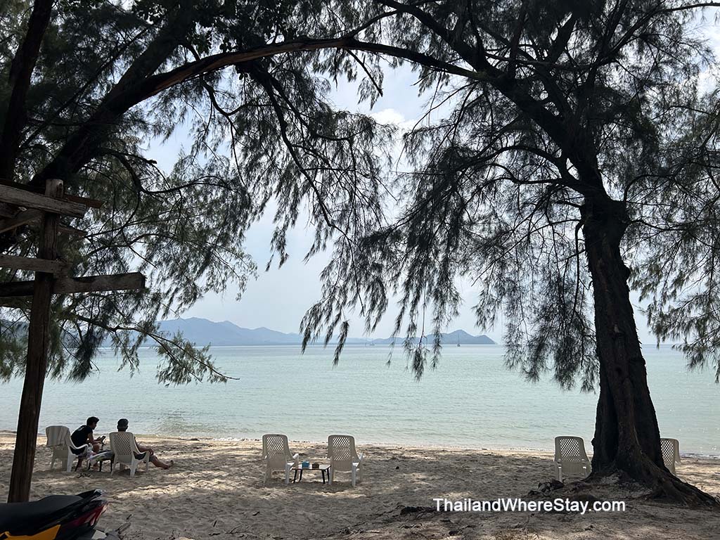 Chairs, tables, and shaded areas on Klong Son Beach